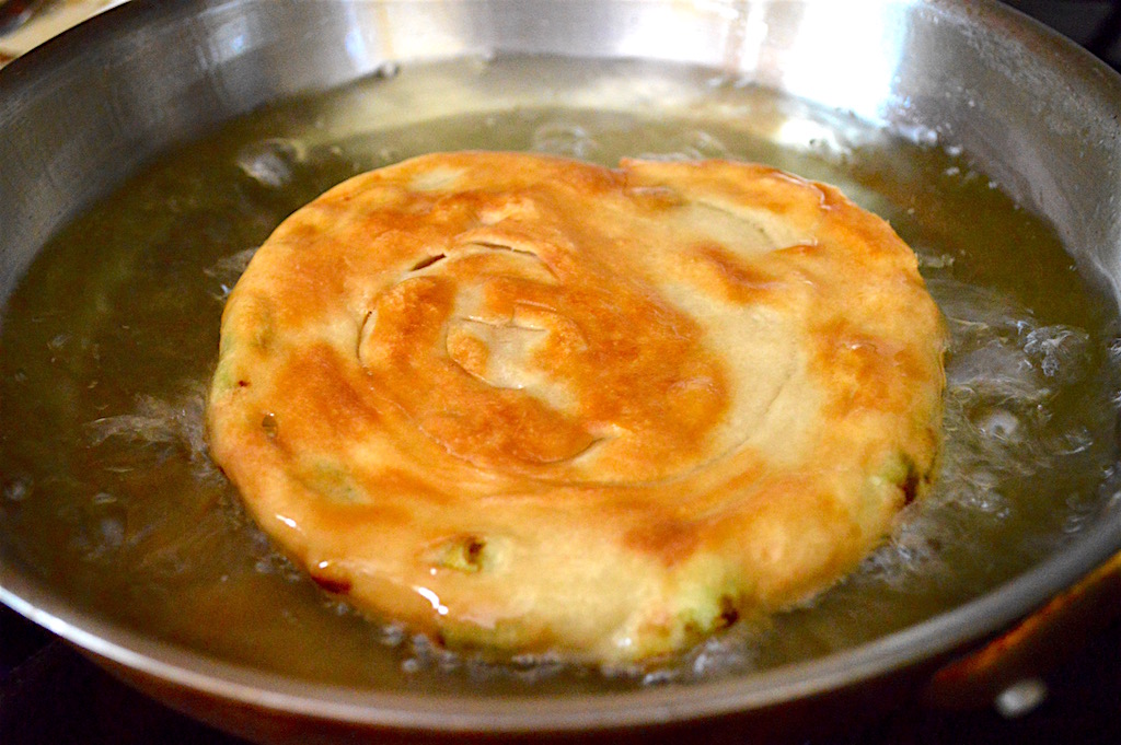 That lovely little pancake was fried in my trusty stainless steel skillet with lots of canola oil. It puffed up and became so gorgeously golden brown! It took about 4 minutes on each side to cook the Chinese scallion bread.