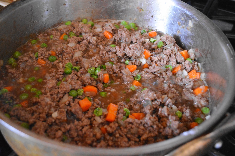 While the potatoes boiled, I got the filling going. This way everything would be done at the same time! The filling was such an incredible mixture of beef, aromatics, and lots of Guinness for loads of flavor. It needed to simmer together for 15 minutes before it went into the pie dish. That allowed the liquid to cook off and the mixture to thicken. It smelled so incredible!