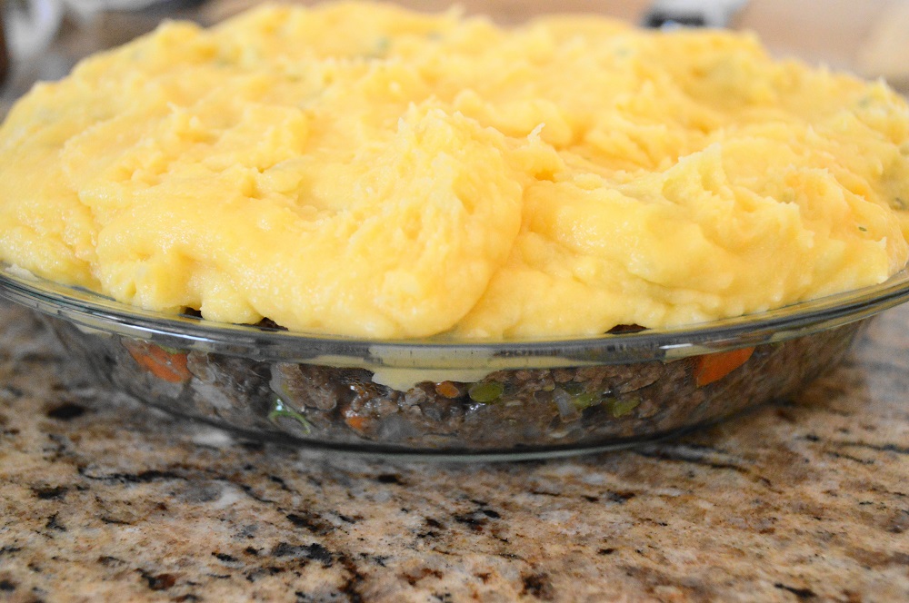 I used a 9 inch pie dish to assemble my shepherd's pie. That savory, beefy filling was packed in tight. Then I spooned those glorious and fluffy potatoes on top to seal in the filling. 