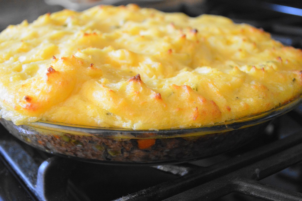 I baked the shepherd's pie for 25 minutes at 400 degrees. That let the potatoes get wonderfully browned on top and melded everything together! Then it just needed to cool a minute before eating. 