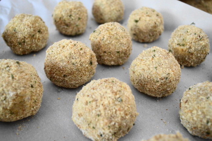 The beef arancini rolled up, breaded and ready to fry! 