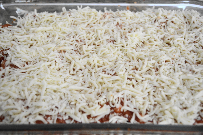 The tray of shrimp scampi lasagna rolls all prepared. 