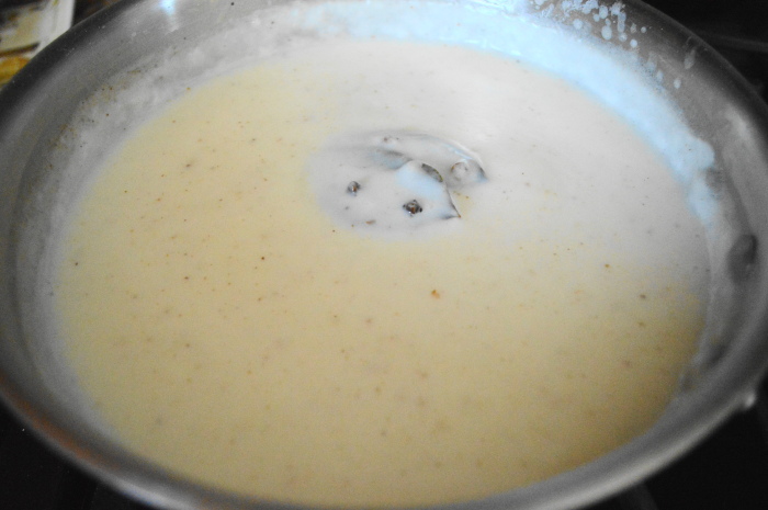 The bechamel sauce bubbling away. It's the perfect base for this pumpkin sausage mac and cheese!