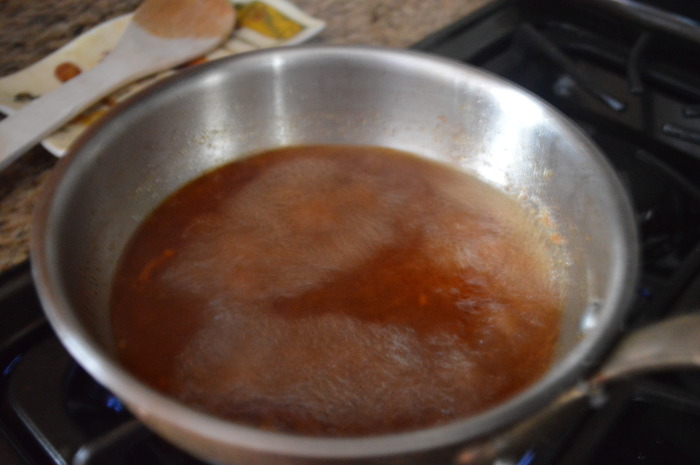 The slow cooker pulled pork sauce boiling away on the stove. It just brings out the flavors so much! 