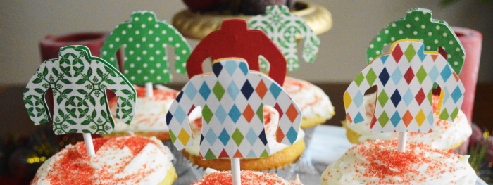 Close up on the adorable ugly sweater toppers for the eggnog cupcakes. 
