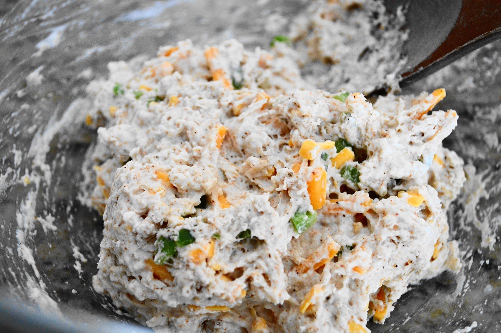 To make the dough I whisked together flour, baking powder, salt, chili powder and cumin in a big mixing bowl to aerate it. The diced jalapeno, lots of cheddar cheese and almond milk were gently stirred in next just until I had a soft dough form. The most important thing with these cheddar jalapeno scones was to not over work the dough. 