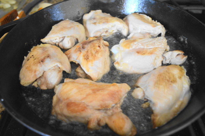 The pan roasted chicken thighs getting gorgeously golden!