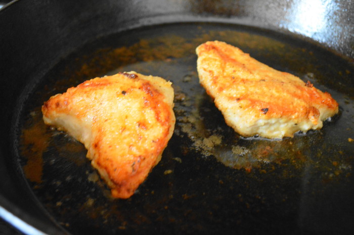 The pan fried chicken developing that lovely crust!