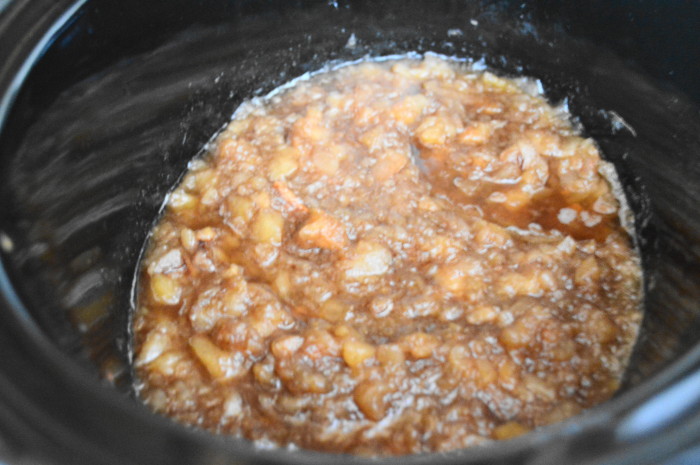 When the four hours were up, the flavor went in. I used brown sugar, cinnamon, vanilla and apple cider vinegar. The slow cooker cinnamon apple sauce was looking good already!