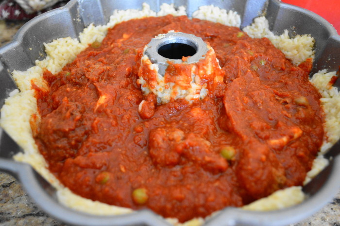 I mixed diced up fresh mozzarella into my meatball filling and spooned it into the well of the bundt pan. There was lots of sauce leftover for serving!