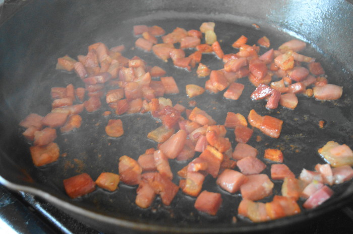 I let that pancetta crisp up and render out in my trusty cast iron skillet. When it was done, I removed it with a slotted spoon to drain on a plate lined with paper towel. 