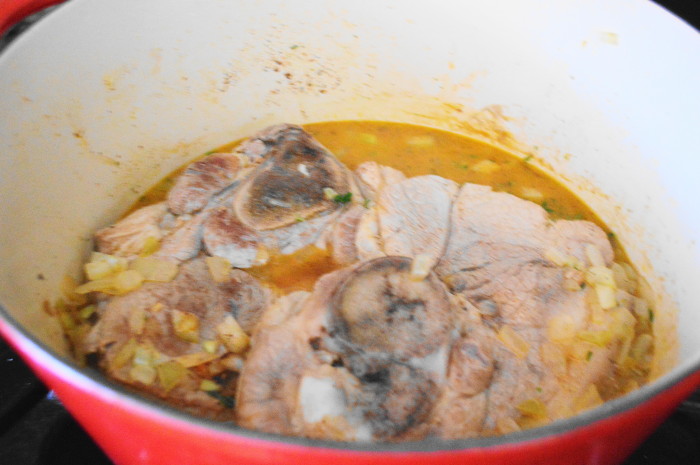 After I browned my pork, it was time for loads of flavor. I added onion, garlic, rosemary and cilantro. Then hard apple cider, chicken stock, Worcestershire sauce and bay leaves went in to finish the filling of the carnitas tacos. 