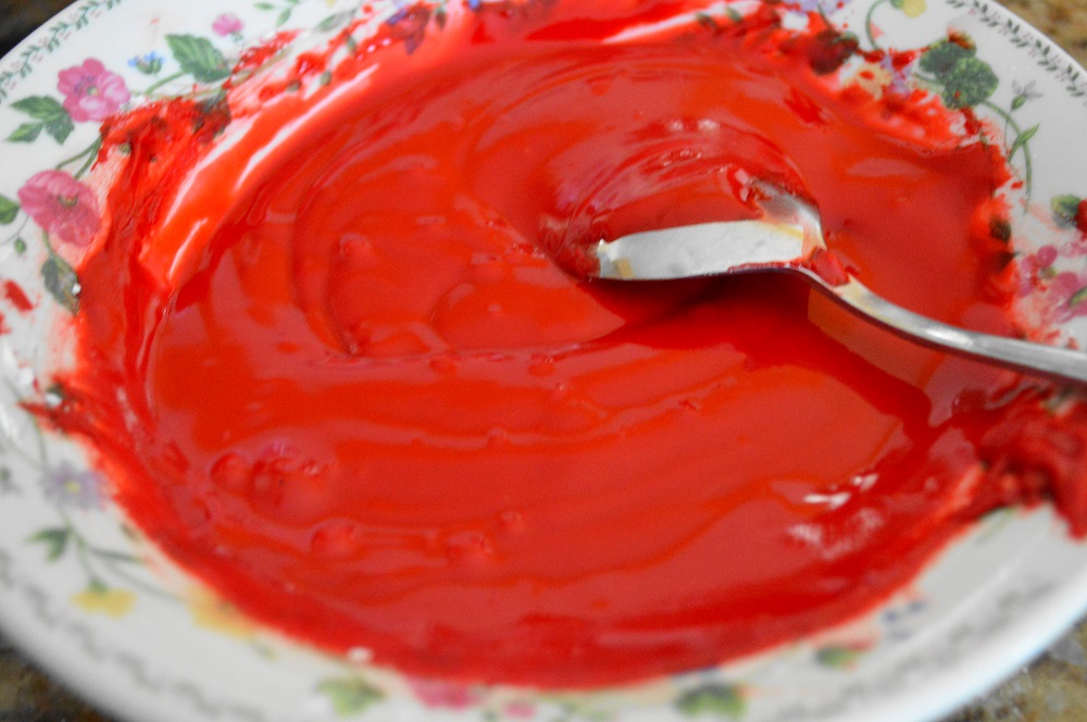 While the cookies baked, I made the simple glaze. Red food coloring made it festive and ready for Holiday giving!