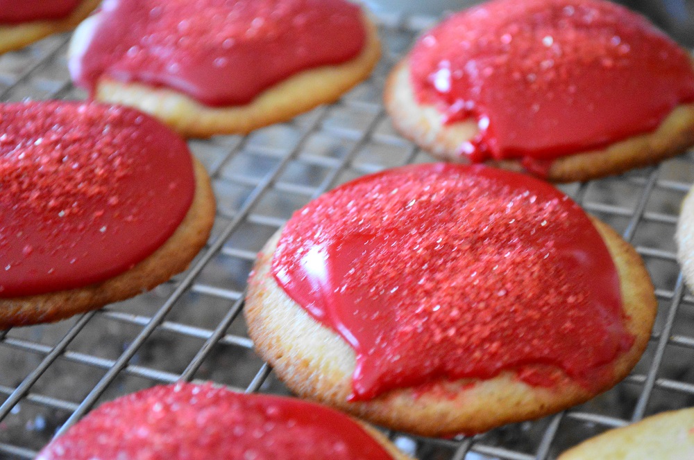 The cooled mascarpone rose cookies each got a small spoonful of the glaze on top and then a sprinkling of red sugar before the glaze set. They looked like sparkly rubies, I was so excited!