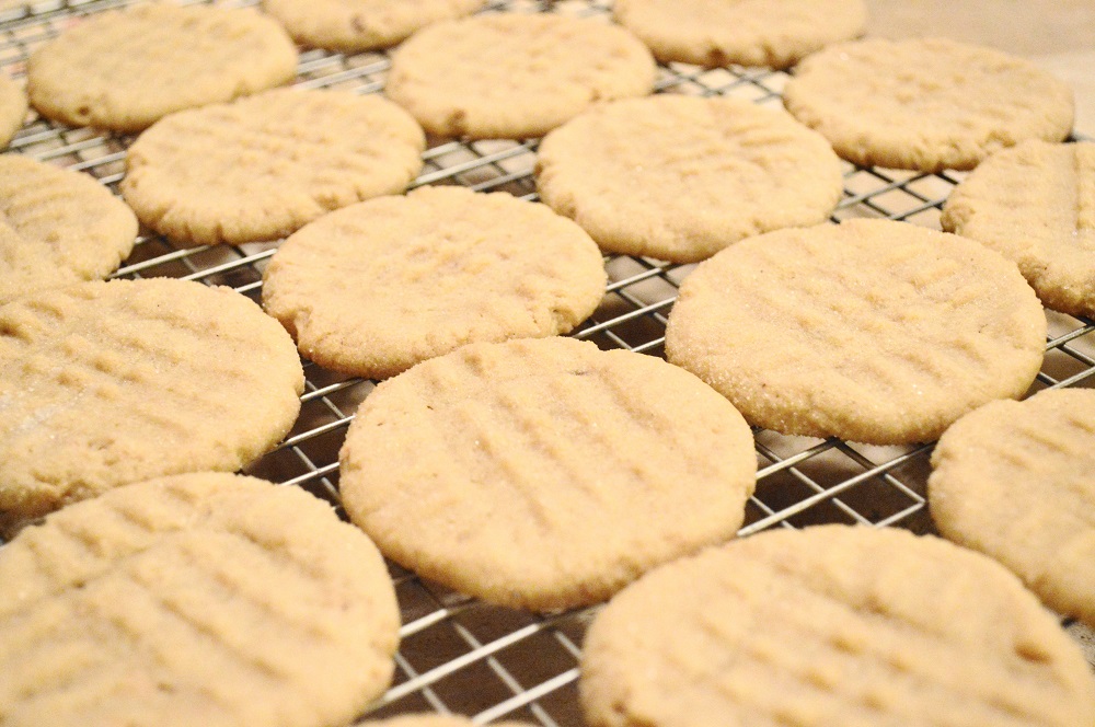 After the peanut butter cookies cooled a little on the trays when they were done, I transferred them to cooling racks so that they wouldn't bake any more. When they were completely cooled I packed them up and hid them from hubby so that some would make it out the door to give. Ha!