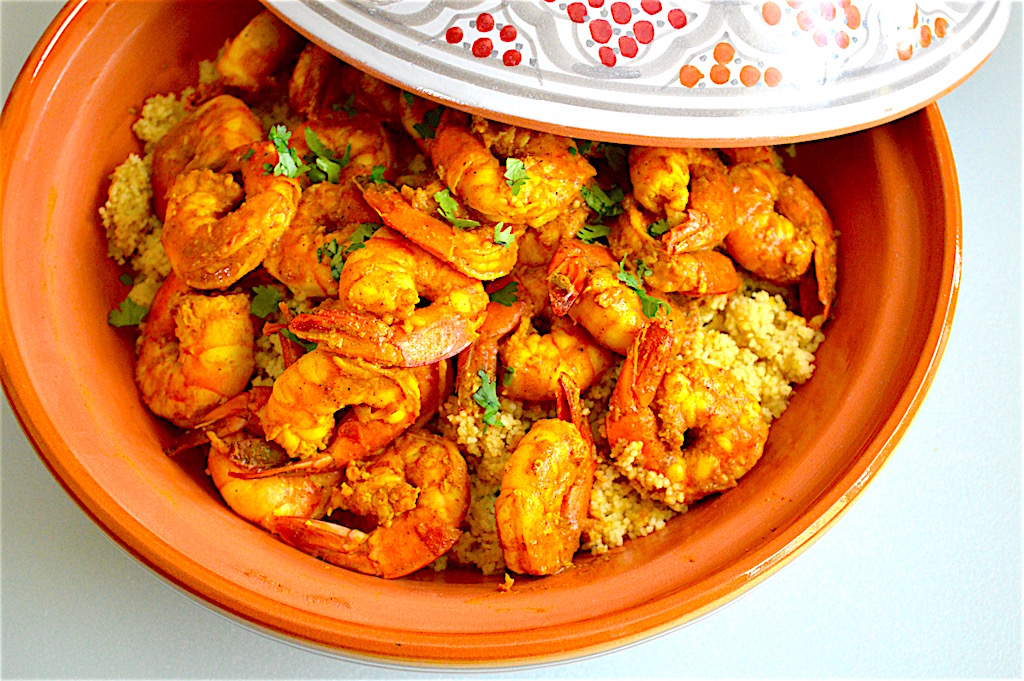 That was all there was to the meal. The Moroccan style shrimp was ready to serve! I scooped the couscous into my pretty tagine and poured the shrimp with its glorious sauce on top of it. I loved serving family style like this. Tasting it was like getting transported to Morocco! The shrimp were so succulent and the couscous was so fluffy. I almost forgot how cold it was outside for a minute, until I had to go outside to take the garbage out. Ha! xoxo