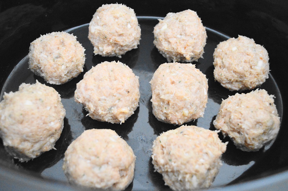 The chicken meatballs had a fantastic mixture of garlic, Sriracha, Worcestershire sauce and seasoning for loads of flavor. I lined them up in the bottom of my beloved crock pot. 