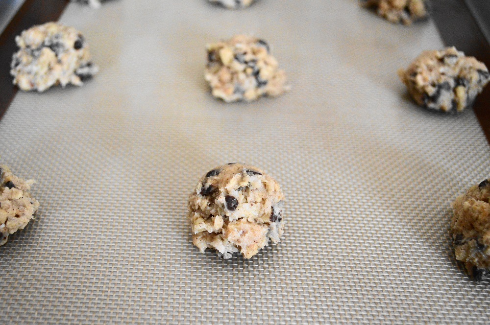 I've said it before and I'll say it again. My cookie scoop has become my baking BFF. It made scooping perfect mounds of the dough onto my lined baking sheets so easy. I filled all four of my sheets with 13 mounds of the dough for 52 chunky granola cookies total. 