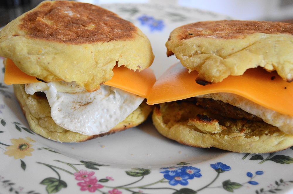 Once the eggs were cooked I quickly assembled the homemade breakfast sausage sandwiches. I wanted to make sure everything was hot. I layered the sausage patties first, then the eggs, and finally a slice of extra sharp cheddar. It started to melt right on the hot egg!