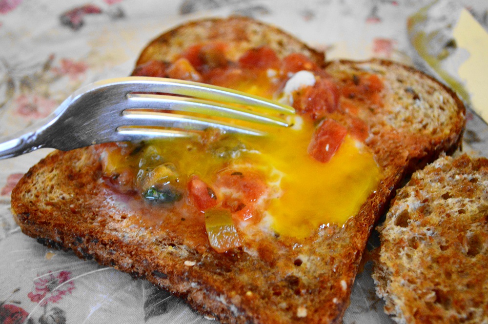 I topped each spicy egg in the hole with a spoonful of salsa. Then it was time for my favorite moment in eating. It's a thing with me. I cut into that perfectly cooked egg yolk and it ran all over the toast. The way it mingled with the salsa made me so happy. It was such an incredible and simple breakfast to warm us up! xoxo