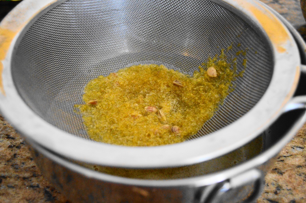 I needed to strain that mixture to get the lemon zest and any seeds that fell in out. My fine mesh strainer was perfect for the job. 
