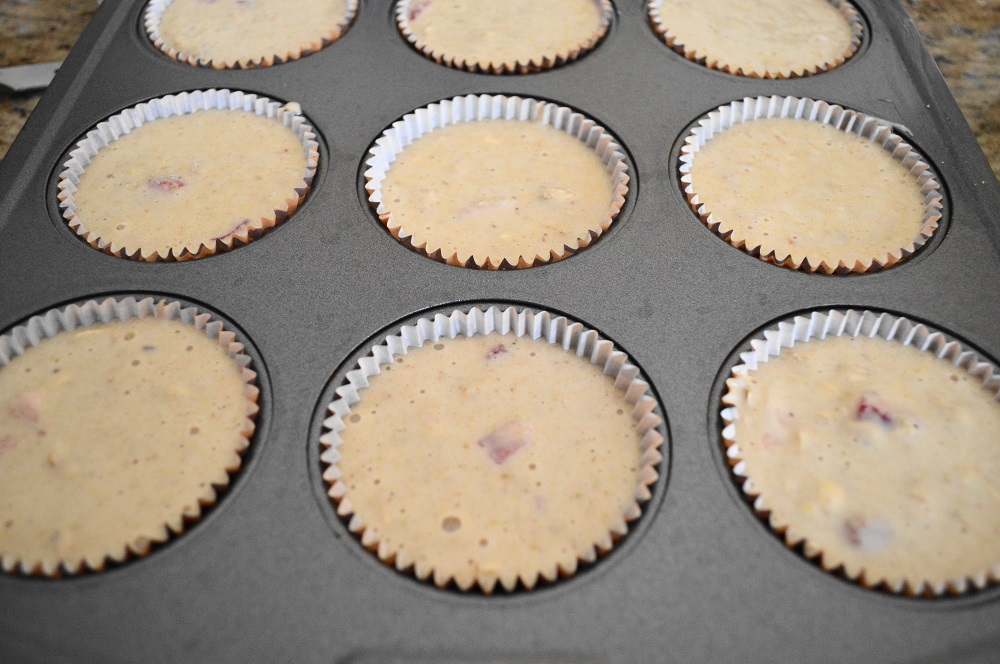 I used a 1/3 cup measure to evenly distribute the batter in my lined muffin tin. I ended up having more batter, so I took my second pan and filled 3 more lined muffin wells. This recipe yielded 15 strawberry yogurt oat muffins total, which was perfect!