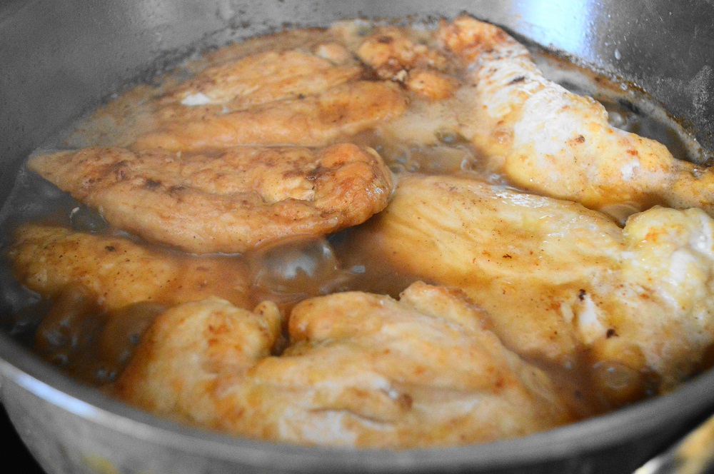 Once the chicken was all pan fried, it was time to quickly make the chicken piccata sauce. It was simply chicken stock, lemon juice, lemon zest and capers. I loved the clean, very Italian flavors here! Once the sauce was assembled, I nestled all of the chicken back in to bath in it for 10 minutes. 