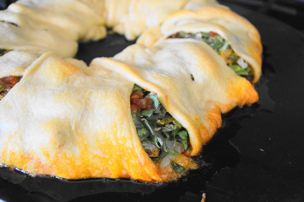 The taco crescent ring baked for 20 minutes or so, until the crescent rolls were crispy and golden. Then I just let it cool for a minute before serving! Oh my goodness, it was all of the components of a great taco wrapped up in a flaky crescent crust. I was in heaven and right back in my mother's kitchen (which could be the same place in my book). Enjoy!! xoxo