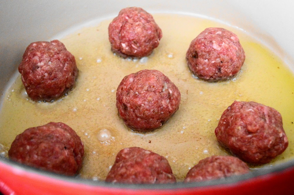 The key to juicy meatballs was to use a panada instead of breadcrumbs. A panada is just a fancy word for soaking bread in milk and it makes all the difference in the world. I also had a sneaky trick for adding more flavor. I browned the meatballs in bacon fat that I had reserved after cooking bacon over the weekend! 