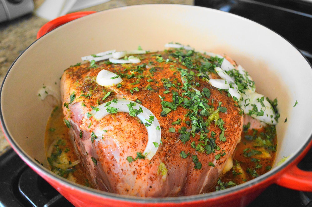 I used my huge, sturdy and trusty Dutch oven for the cooking job. I browned the pork first in a little olive oil to really bring out the flavors of the spices. Then that poor, unused tequila went in with lots of lime juice, lime zest, chicken stock, cilantro and onion. It smelled incredible from the start! That was all there was to putting together the pork mixture for the tequila lime pulled pork sandwiches!