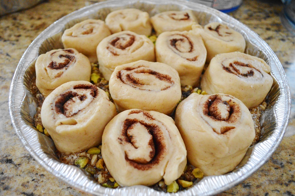 I put 12 pistachio, lavender and honey sticky buns into each pan and gently pressed them into the glaze. Then they needed to sit and proof again to get more puffy for an hour. It was an exercise in patience but so worth it!