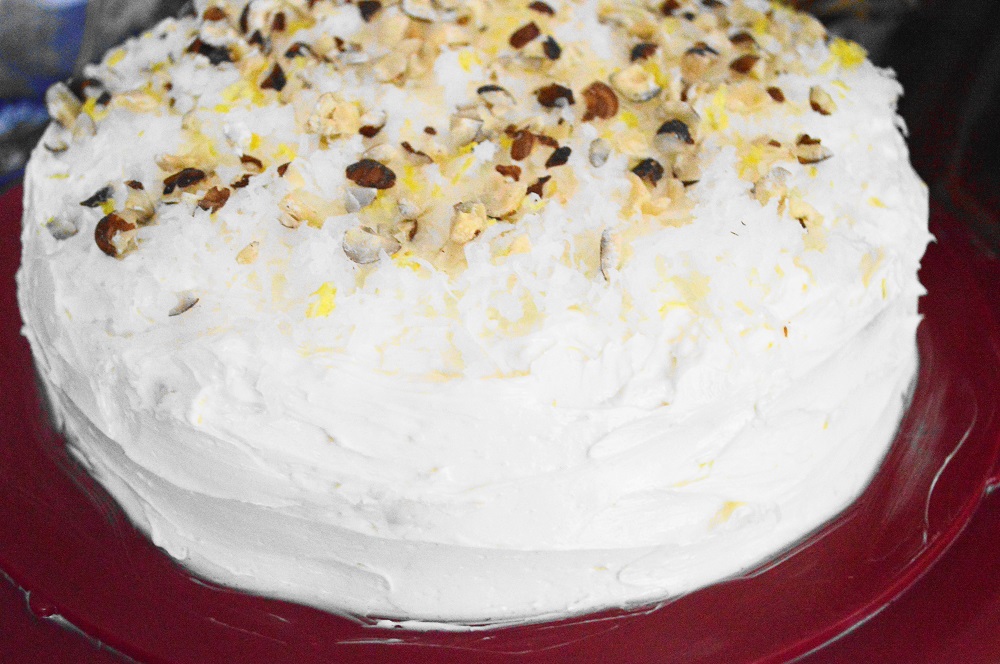Once I frosted the lemon coconut cake, I just topped it with shredded coconut, lemon zest and chopped hazelnuts for some crunch. It was so pretty I could cry! 