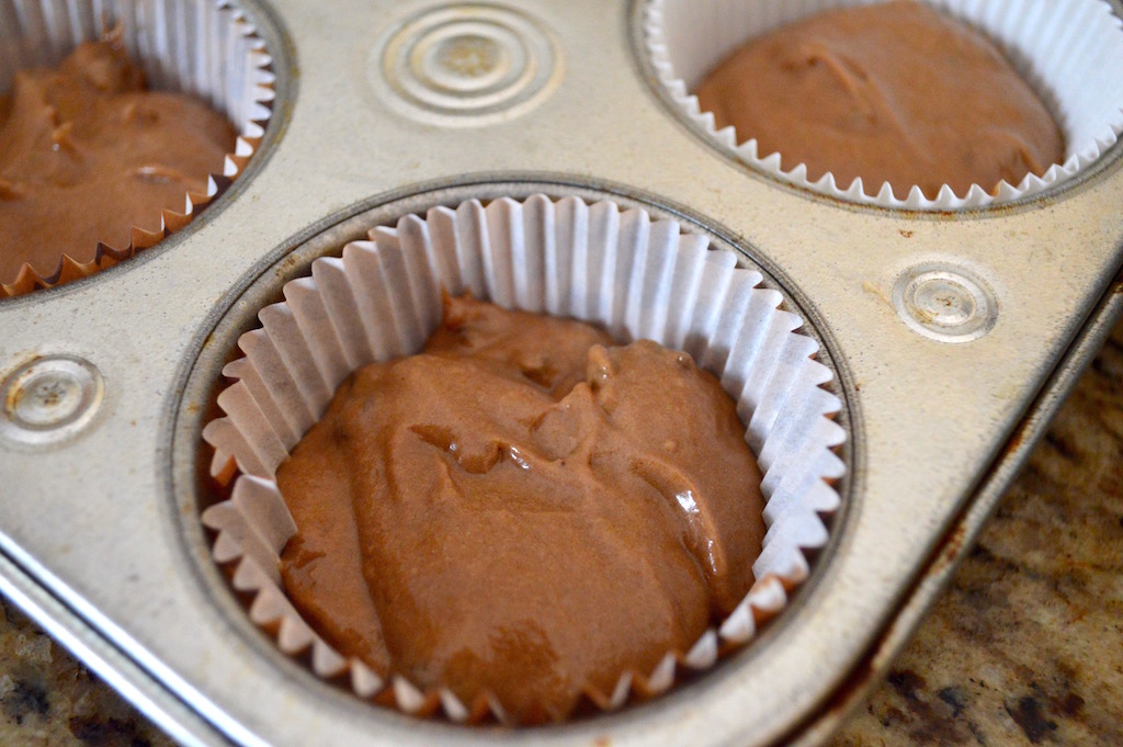 I used my handy 1.5 inch cookie scoop to distribute the batter evenly among my two lined muffin pans. This recipe ended up yielding a perfect two dozen chocolate espresso muffins!