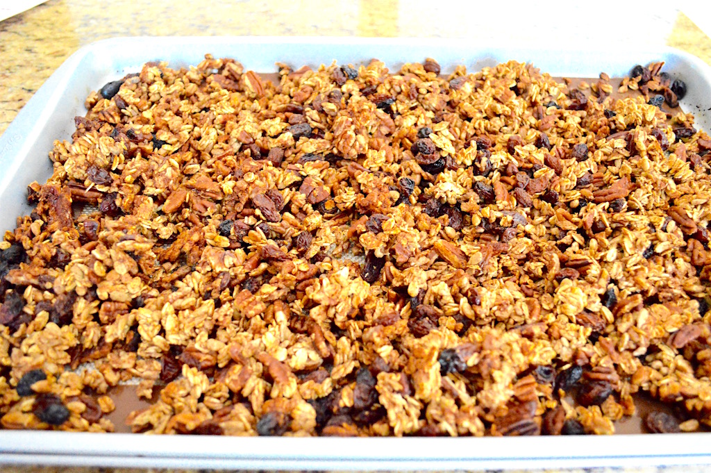 Once the maple pecan granola was done baking, it was so golden and gorgeous! It also made the whole house smell incredible with all of the cinnamon I used. I released it all from the mat and gave it a good toss. Then it went back into the turned off oven. The oven was still hot without being on. That dried out the granola without baking it further. Drying it out was important to make it crumbly and crunchy!