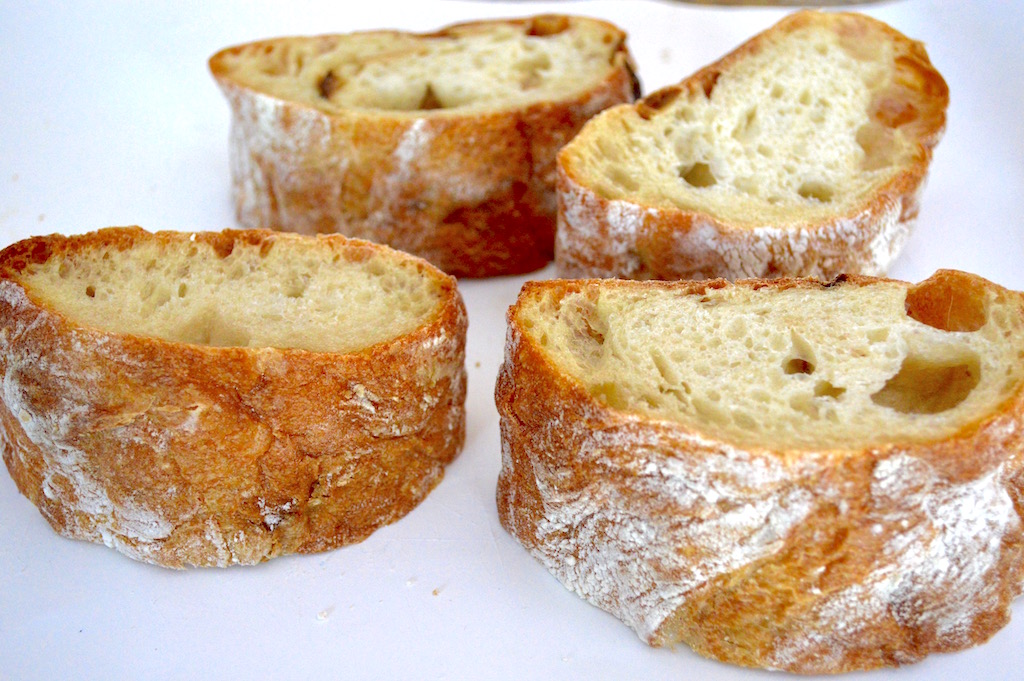 The bread in this savory stuffed French toast was the most important to get right. I found roasted garlic ciabatta bread in my store and it ended up being so perfect! I used half of the loaf in this recipe and sliced it into 4 really thick slices. I set the heel aside for later use so that all of the slices were the same and had the interior exposed. 