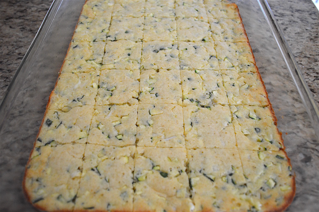 I could tell the zucchini squares were done when they just started to brown around the edges and become golden on top. After I let them cool for 20 minutes, I just cut them into 30 squares. That meant cutting 4 equal lines down the length of the pan and 5 equal lines down the width. That made them the perfect party size!