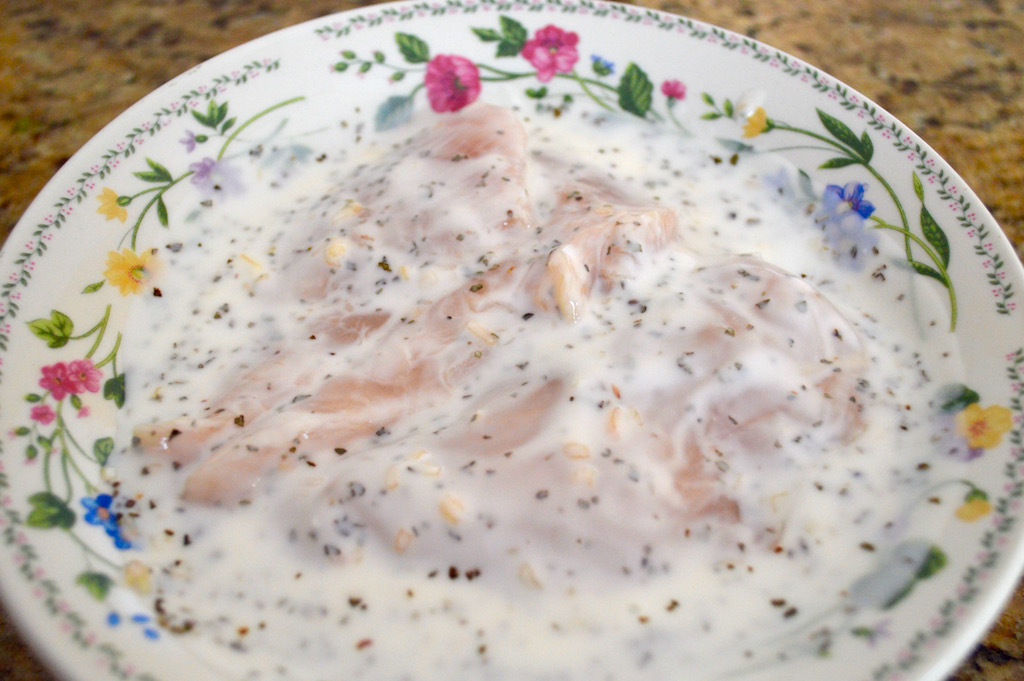 After I made the pesto sauce, I decided to marinate the chicken for a bit. I used buttermilk, dried basil and dried onion for loads of flavor. The acidity in the buttermilk also tenderized the chicken and kept it juicy! I let the chicken sit in the marinade for 15 minutes. 