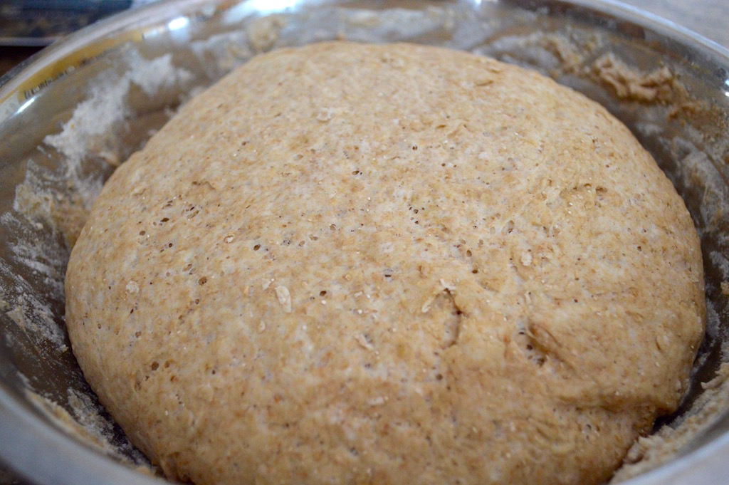 I let the dough for the whole wheat pita bread double in size in a warm, dry corner in my kitchen. Yeast is magical to me. My ball of dough became so huge! I punched it down (more stress relief) so that I could start getting it portioned and rolled out. 