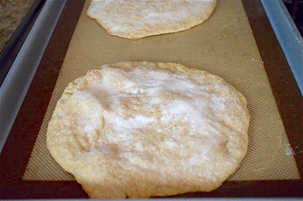 I baked the whole wheat pita bread for just 8 minutes. It came out so puffy and golden! I fit two discs per sheet tray and baked 4 at a time. It took 5 batches to bake 20 pita total! I also made sure to rotate my trays halfway through so that they baked evenly. 