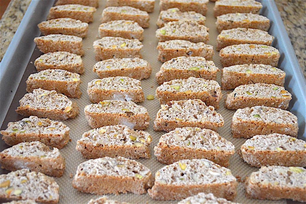 I sliced those logs into roughly 1/2 inch thick pieces. They were so cute and perfectly shaped! Once I sliced the hazelnut pistachio biscotti, they needed to bake again to crisp up the interior. It gave them that signature crispy texture! 