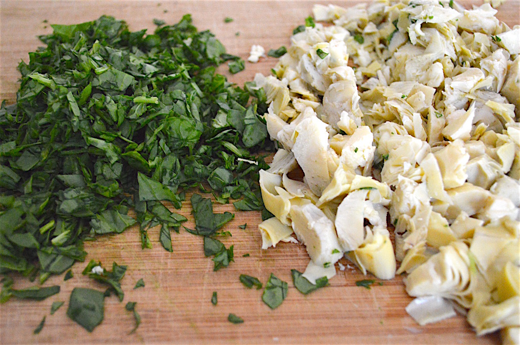 First, I just quickly chopped a whole bunch of fresh baby spinach and jarred artichoke hearts that I drained. They gave the spinach artichoke dip pasta so much texture and flavor! There is something about the way they compliment each other that just works so beautifully. 