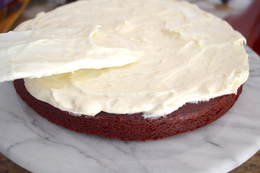 When it was time to put the red velvet cake together, I decided to not frost the sides. I really wanted the red to show through for those patriotic colors. I smoothed out a thick later in the middle, and then on top before I decorated! 