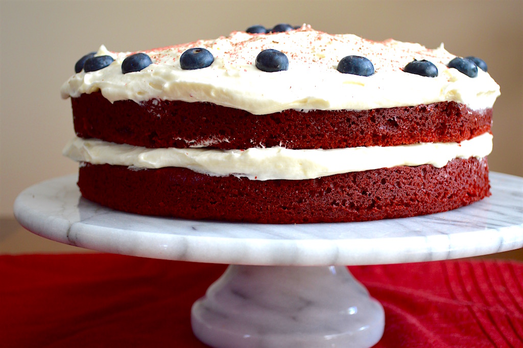 I topped off the red velvet cake with blueberries to almost look like the flag. Then I sprinkled shaved chocolate and red crystallized sugar on top! It looked so pretty and tasted even better than it looked. The cake was incredibly tender with that decadent cream cheese frosting. Hope you all enjoy this July 4th ready dessert! xoxo