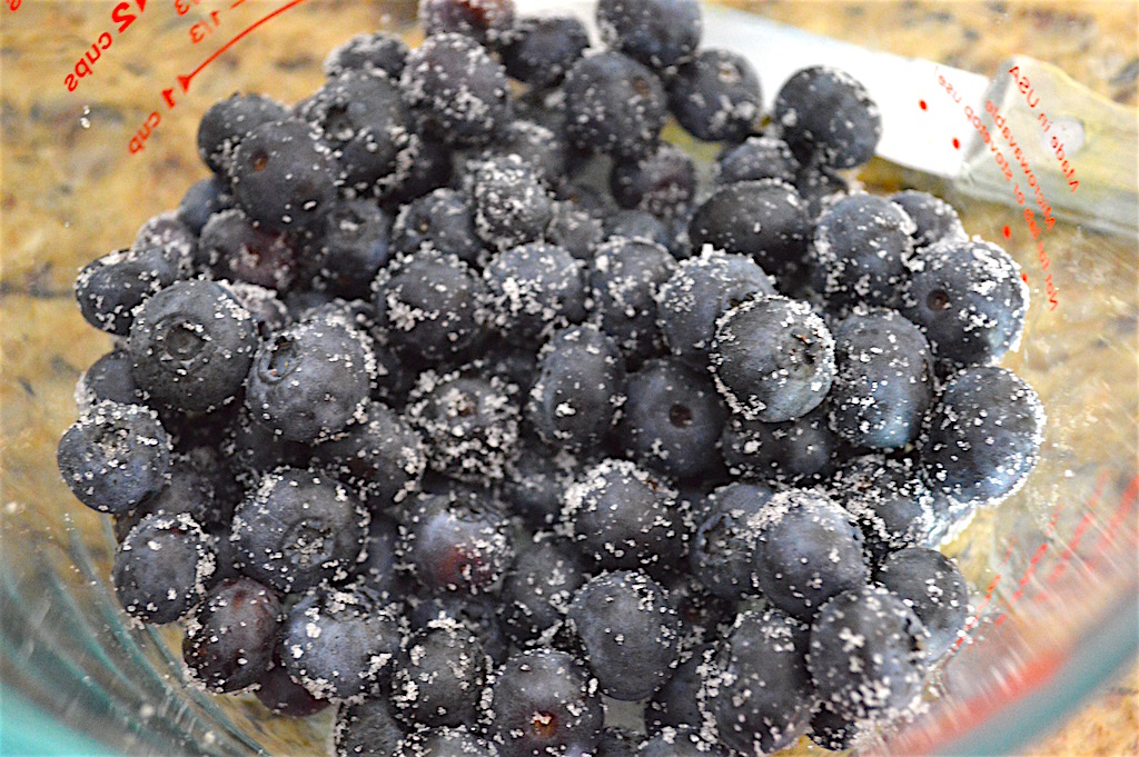 Blueberries have a tendency to sink to the bottom when they bake in batters. To make sure that didn't happen, I stirred them with a little sugar. The sugar helped them hang on in the batter and stay suspended! 