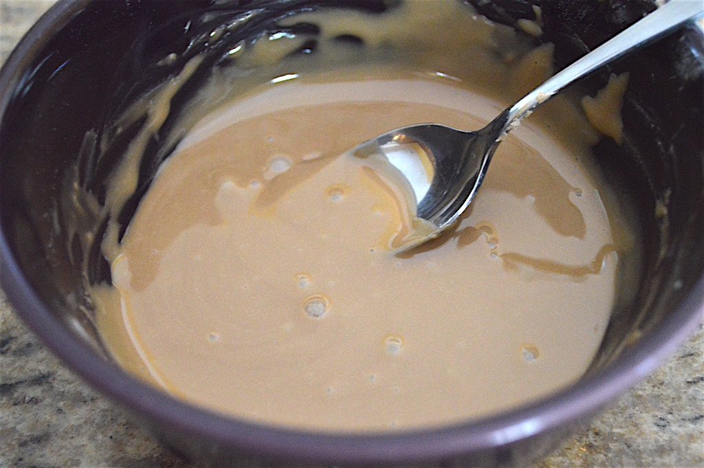 While the lemon blueberry muffins baked and cooled, I made an easy and amazing blueberry balsamic glaze. It just felt like the right thing to do! All I did was stir powdered sugar, blueberry balsamic vinegar and water together in a bowl. 