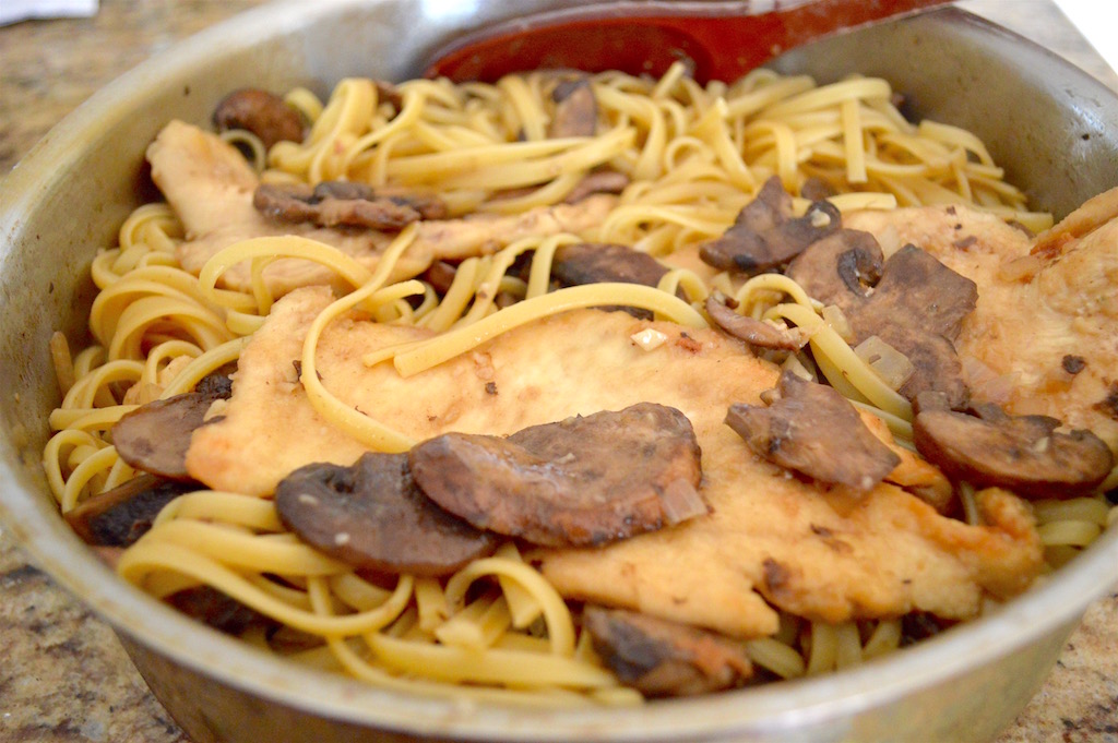 I cooked the chicken more in that lovely sauce for 15 minutes so that it would both absorb the flavor of the sauce, and also give the sauce more flavor. It was a gorgeous symbiotic relationship! The last touch was to toss in a pound of tender, cooked linguine. That was all there was to making the chicken marsala!