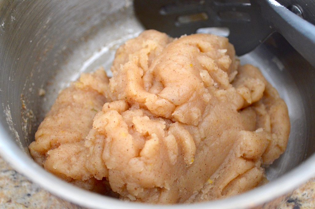 The dough for the lemon lavender zeppole was very similar to choux pastry, which is the dough cream puffs and eclairs are made from. I gently boiled a mixture of butter, water, sugar, ground lavender, cinnamon and salt. Then I brought it together in the pot with flour and let the dough gently cook while I stirred it. 