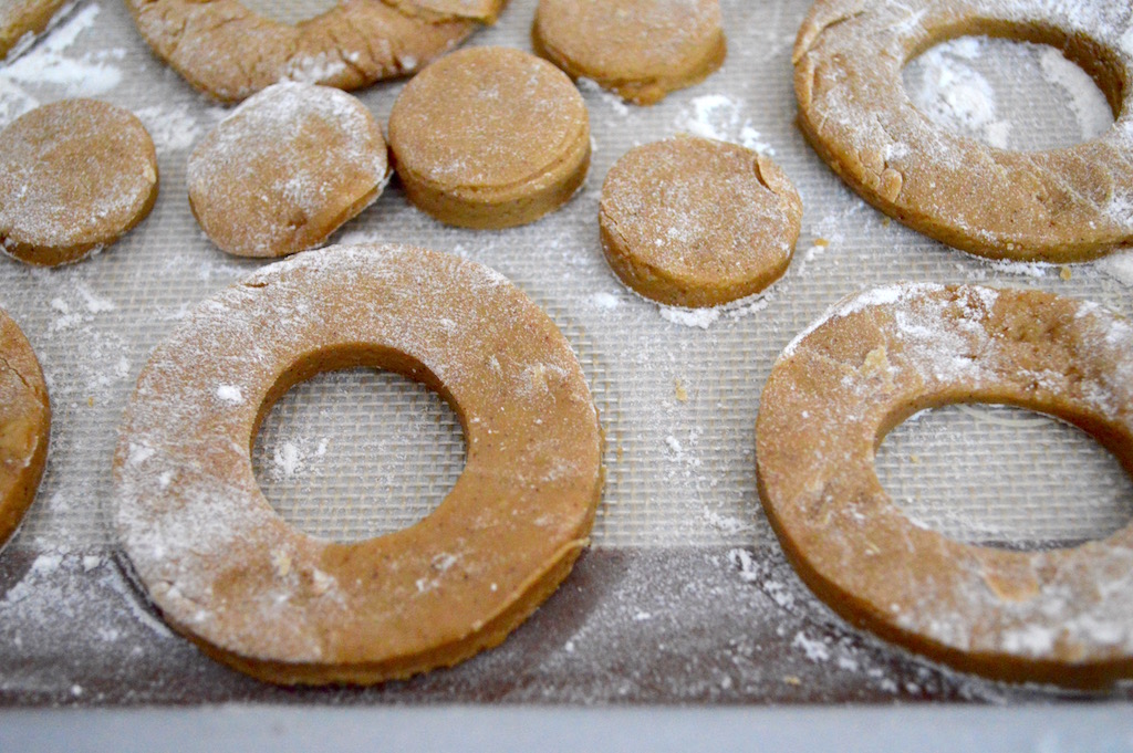 I used my donut cutter to cut out perfect little apple cider donuts and donut holes! I laid them all out on another well floured sheet tray and chilled them for another 10 minutes. 