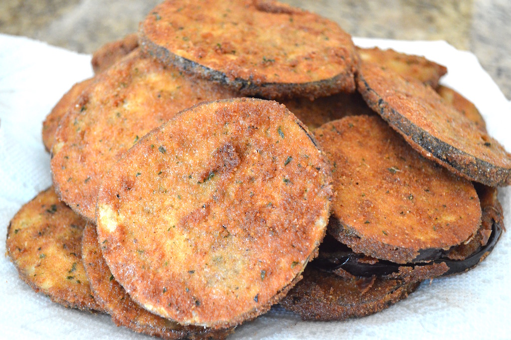 Then it was an exercise in patience as I fried all of the eggplant slices in small batches of 4 or 5. They cooked for about 2-3 minutes on each side to get gorgeously golden and crispy. The patience was worth it because frying the eggplant like that was going to give the eggplant parmigiana amazing texture and flavor! 