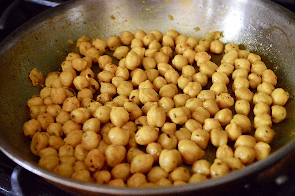 I prepared the chickpeas first for this classic chickpea hummus. They cooked in a little olive oil just for a minute with salt, turmeric and dried oregano. It was a simple way to really make the chickpeas sing! While the pan was still hot but off the heat, I added in my garlic. That allowed it to get fragrant a meld right into the chickpeas.